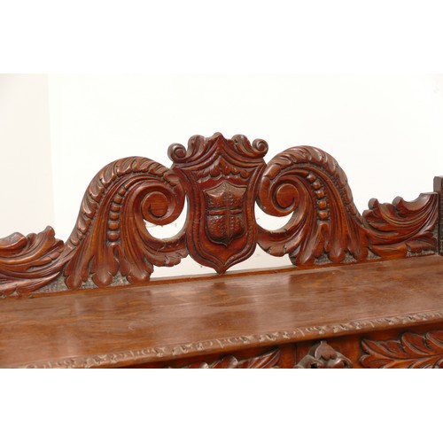 517 - A Victorian carved oak side table with scroll back rail over turned legs, 113 x 45 x 110cm.