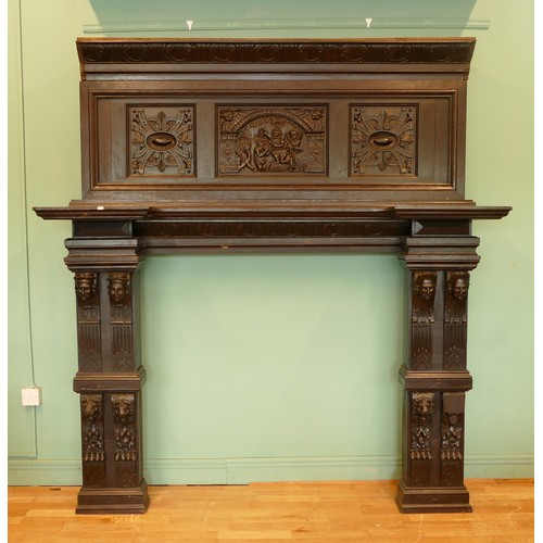 519 - A 19th century and later stained oak fireplace, with central carved panel depicting the baptism of C... 