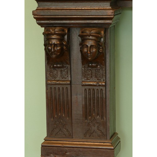 519 - A 19th century and later stained oak fireplace, with central carved panel depicting the baptism of C... 