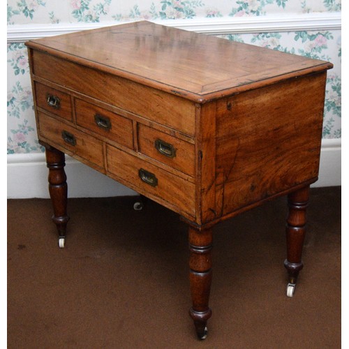 214 - A 19th century mahogany campaign washstand, the hinged lid opening to reveal a tin lined wash bowl, ... 