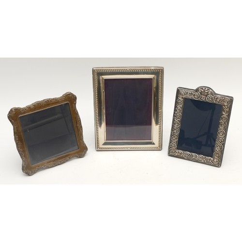 19 - Three silver photograph frames, the largest 22.5 x 17.5 cm, London 1994