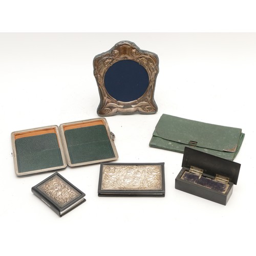 23 - A silver photograph frame Sheffield 1994, 16 x 13.5cm, an unused silver mounted address book, Sheffi... 