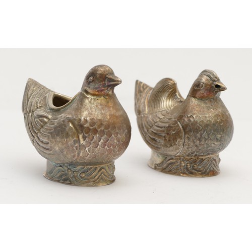 38 - A Chinese silver gilt mustard pot and salt pot, stamped 94 character marks, in the form of birds, be... 