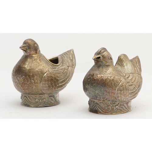 38 - A Chinese silver gilt mustard pot and salt pot, stamped 94 character marks, in the form of birds, be... 