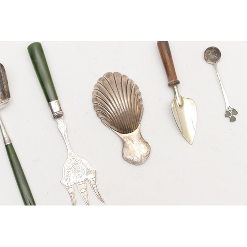 49 - A silver shell bowl caddy spoon, London 1990, a Sterling Silver shovel caddy spoon with nephrite jad... 