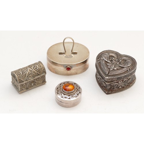 53 - A silver pill box, London 1995, with carnelian thumb piece, 4.5cm, an unmarked silver lovebird heart... 