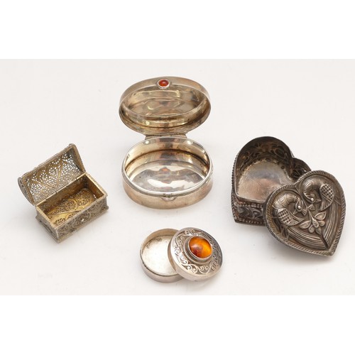 53 - A silver pill box, London 1995, with carnelian thumb piece, 4.5cm, an unmarked silver lovebird heart... 