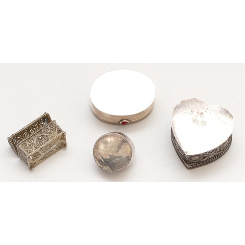 53 - A silver pill box, London 1995, with carnelian thumb piece, 4.5cm, an unmarked silver lovebird heart... 