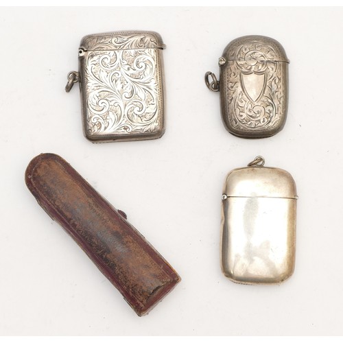 59 - Three silver vesta cases, Birmingham 1904, 1910, (hinge broken, London 1895, 73gm, and a silver moun... 