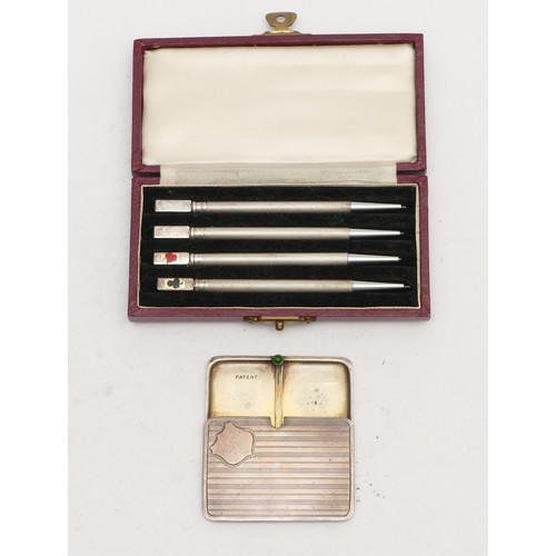 97 - A Sterling Silver set of four propelling pencils, case and a silver double stamp holder, Birmingham ... 