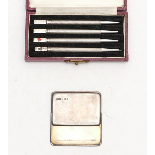 97 - A Sterling Silver set of four propelling pencils, case and a silver double stamp holder, Birmingham ... 