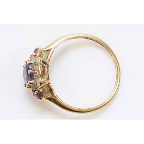 532 - A 9ct gold amethyst and diamond dress ring, L, 1.4g