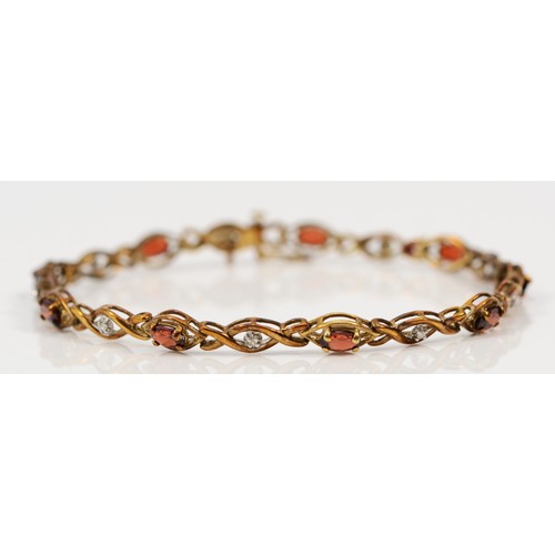 540 - A 9ct gold garnet and diamond bracelet, 18cm, 5g