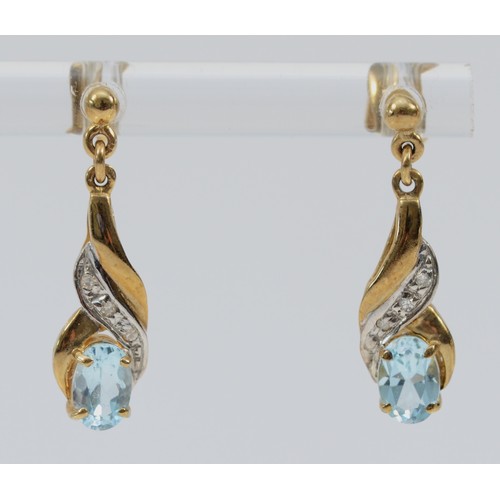 548 - A pair of 9ct gold blue topaz and diamond drop earrings with scroll backs, 20mm total drop, 1.7g