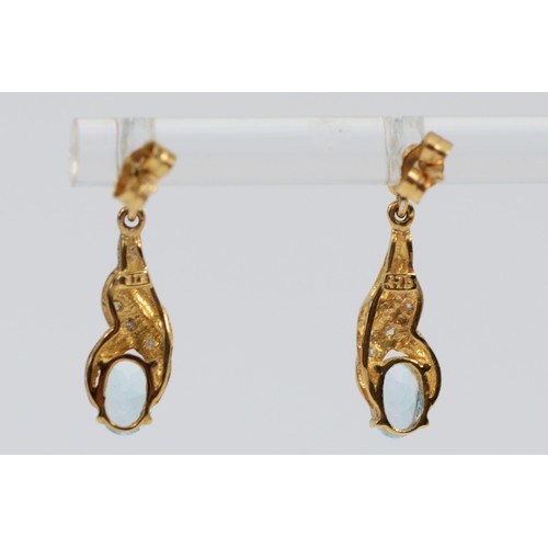 548 - A pair of 9ct gold blue topaz and diamond drop earrings with scroll backs, 20mm total drop, 1.7g