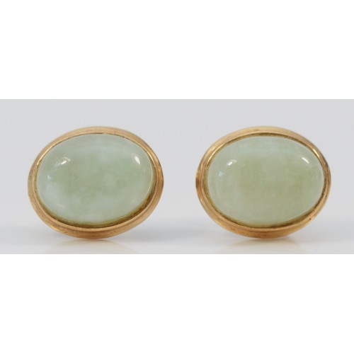 549 - A pair of 9ct gold cabochon cut jade earrings with scroll backs, 10mm, 1.5g