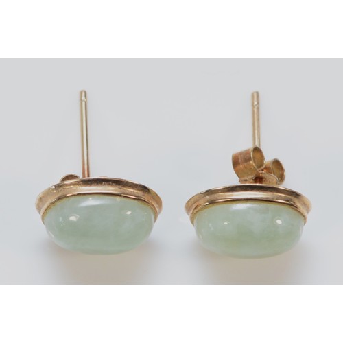 549 - A pair of 9ct gold cabochon cut jade earrings with scroll backs, 10mm, 1.5g