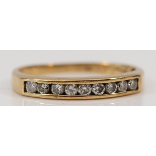 551 - A 9ct gold diamond half eternity ring, channel set, K, 1.4g