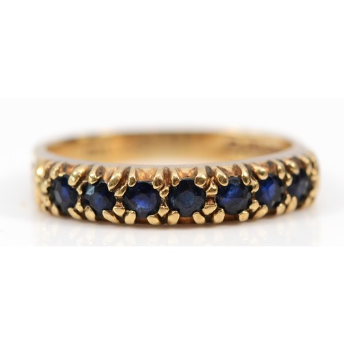 555 - A 9ct gold vintage sapphire half eternity ring, J 1/2, 2.1g