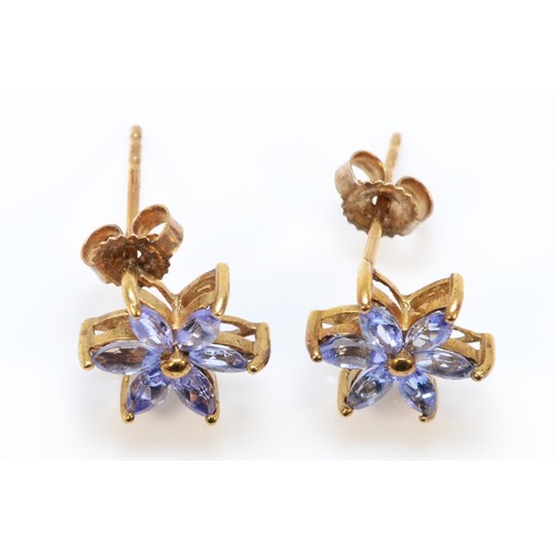 559 - A pair of 9ct gold tanzanite floral earrings with scroll backs, 10mm diameter, 1.6g