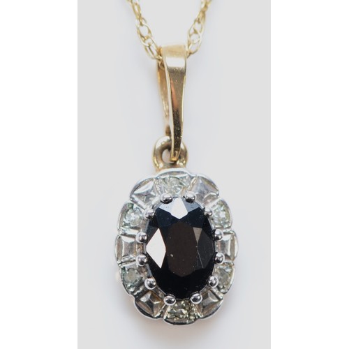 564 - A 9ct gold sapphire and diamond pendant with chain, 10mm, 1.8g