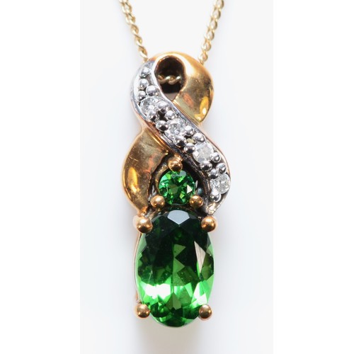 567 - A 9ct gold tourmaline and diamond pendant with chain, 13mm pendant, 1.2g