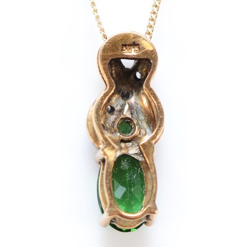 567 - A 9ct gold tourmaline and diamond pendant with chain, 13mm pendant, 1.2g