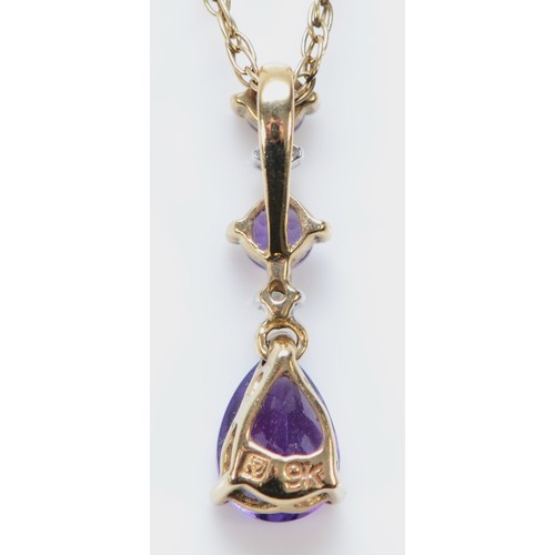 568 - A 9ct gold amethyst and diamond drop pendant with chain, 16mm pendant, 2g