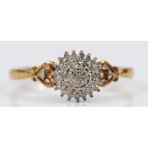 570 - A 9ct gold diamond cluster dress ring, U, 2g