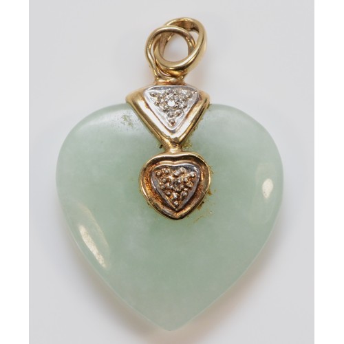 579 - A 9ct gold diamond heart shaped jade pendant, 23mm length, 5.3g