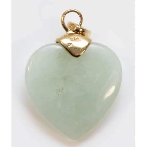 579 - A 9ct gold diamond heart shaped jade pendant, 23mm length, 5.3g