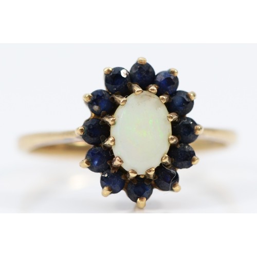 583 - A 9ct gold opal and sapphire oval cluster ring, P, 2.3g