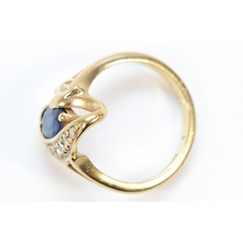 591 - A 9ct gold sapphire and seven diamond dress ring, E 1/2, 2.9g