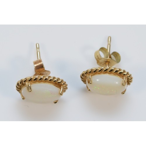 597 - A pair of 9ct gold opal earrings with scroll backs, 12mm, 1.7g