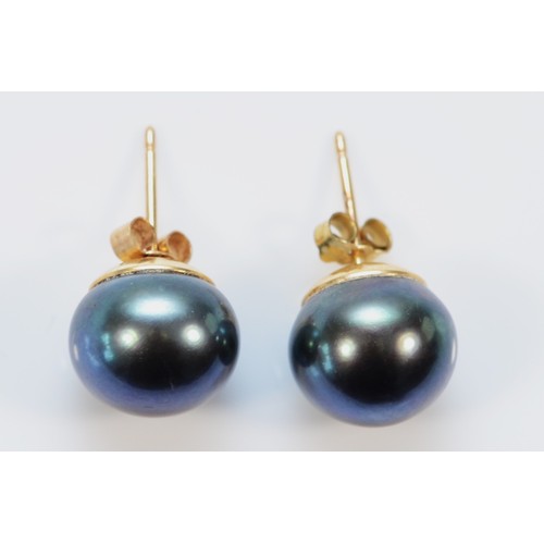 599 - A pair of 9ct gold cultured pearl earrings with scroll backs, 10mm, 3.6g