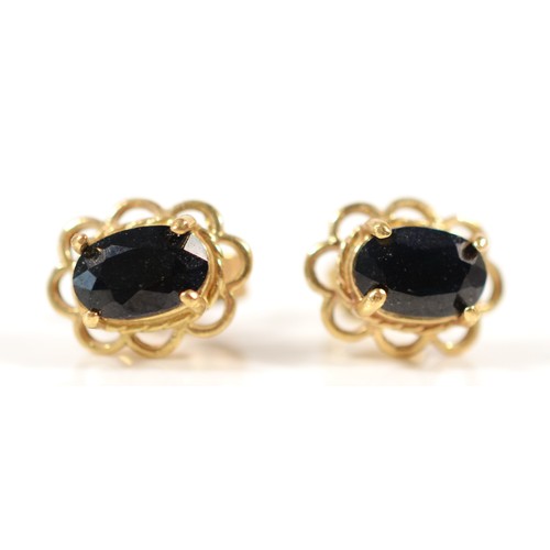 610 - A pair of 9ct gold sapphire earrings with scroll backs, 8mm, 1.1g