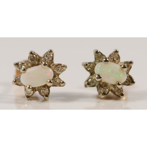 615 - A pair of 9ct gold diamond and opal cluster earrings with scroll backs, 8mm, 1.4g