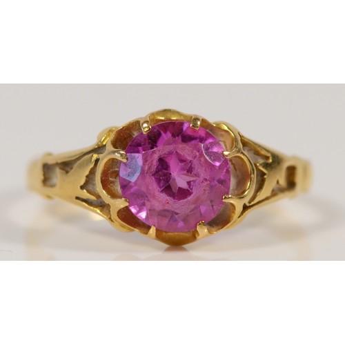 616 - An 18ct gold vintage pink gemstone dress ring with openwork shoulder detail, N, 2.6g