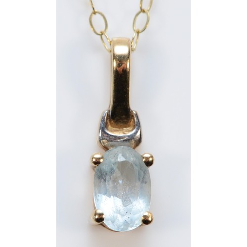 631 - A 9ct gold oval cut blue topaz pendant with chain, 13mm total pendant drop, 0.9g