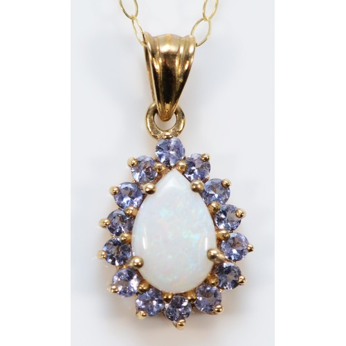 632 - A 9ct gold opal and tanzanite pendant with chain, 12mm pendant, 1.5g