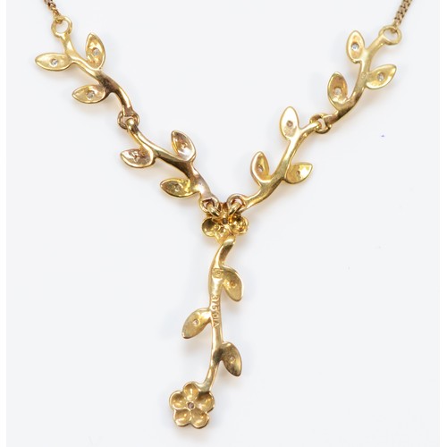 633 - A 9ct gold diamond floral drop necklace,50mm drop, 3g