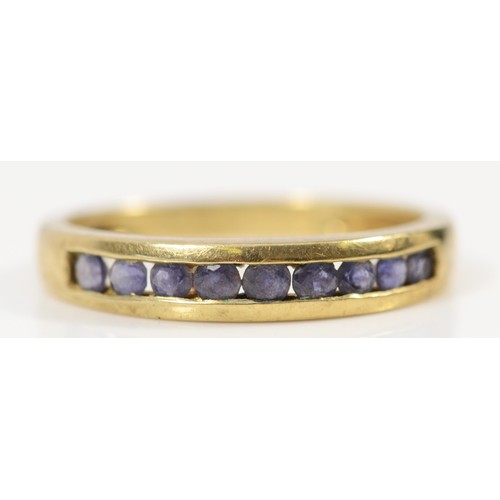 651 - A 9ct gold iolite half eternity ring, K 1/2, 1.6g