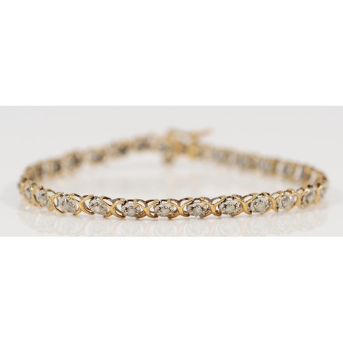 657 - A 9ct gold diamond line bracelet, approx 1ct diamond weight, 18cm, 4.7g