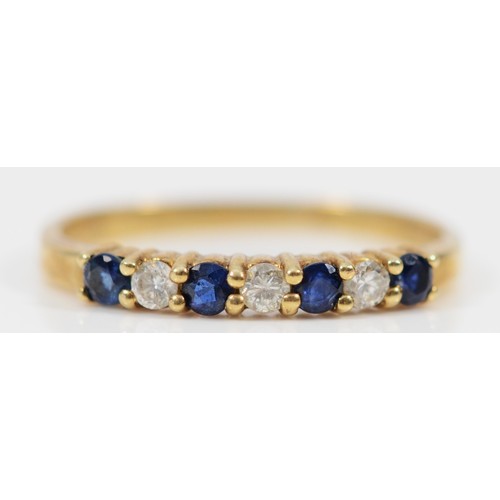 660 - A 9ct gold sapphire and diamond half eternity ring, J, 1.1g