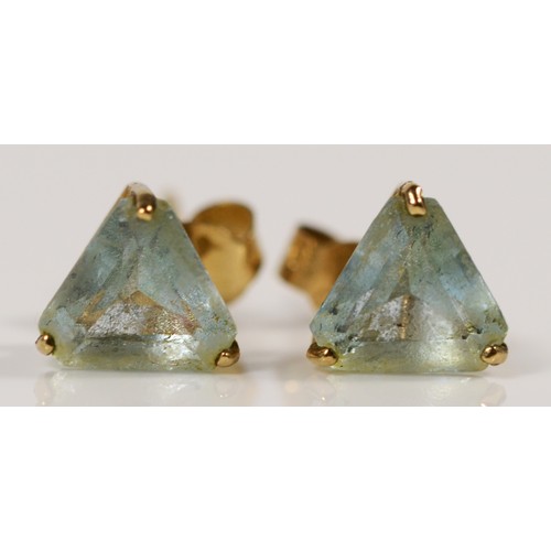 662 - A pair of 9ct gold trilliant cut blue topaz earrings with scroll backs, 0.8g