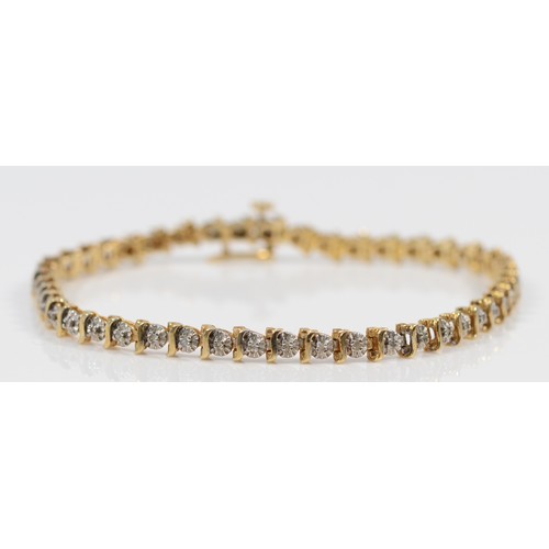 665 - A 9ct gold diamond line bracelet, 18cm, 6.9g