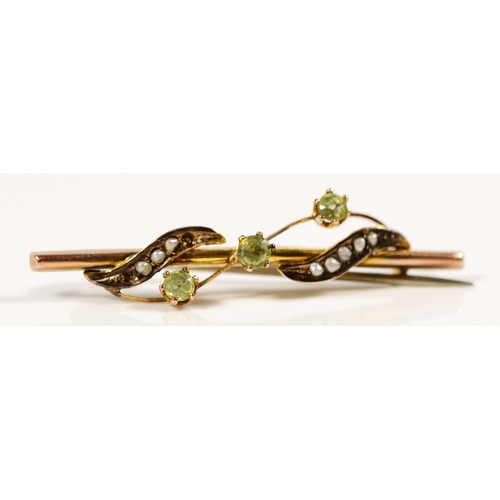 671 - A 9ct gold antique green gemstone and seed pearl brooch, 40mm across, 1.5g