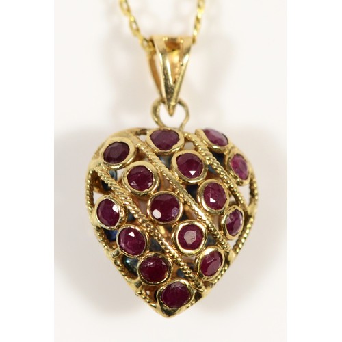 672 - A 9ct gold ruby and sapphire heart shaped pendant with chain, 13mm heart length, 2.8g