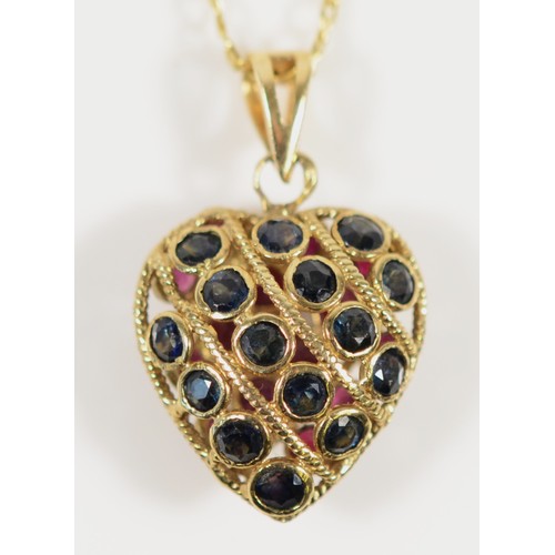 672 - A 9ct gold ruby and sapphire heart shaped pendant with chain, 13mm heart length, 2.8g