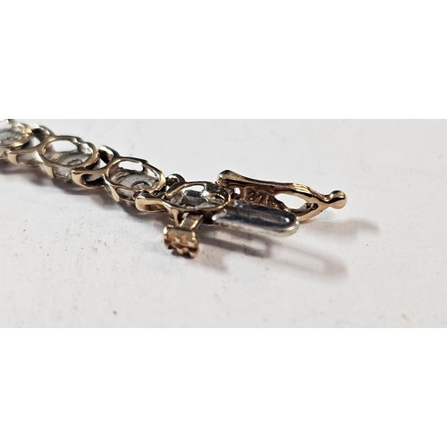 657 - A 9ct gold diamond line bracelet, approx 1ct diamond weight, 18cm, 4.7g